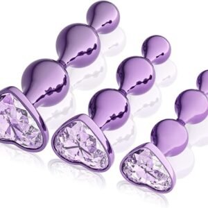 Purple Alloy Anal Plug Set featuring three decorative intimate accessories