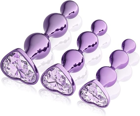 Purple Alloy Anal Plug Set featuring three decorative intimate accessories